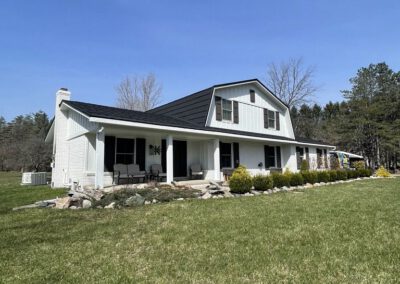 metal roof with black shingles